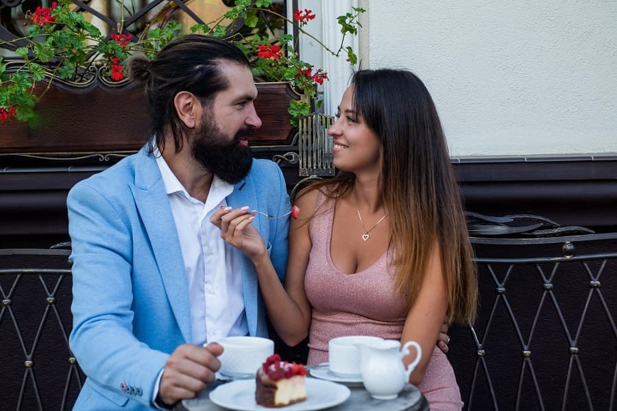 An age gap couple having afternoon tea together